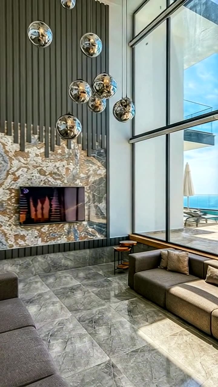 Salón a doble altura con chimenea